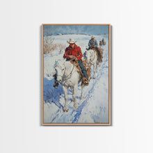 Load image into Gallery viewer, Cowboy Riding Horses in Snow Canvas Print, Winter Wall Art, Rustic Christmas Decor, Holiday Gift Idea, Seasonal Art, Framed Canvas Print