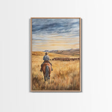 Load image into Gallery viewer, Cowboy leading cattle across golden prairie, Framed Canvas Print, western landscape wall art for rustic farmhouse decor, gift idea holiday