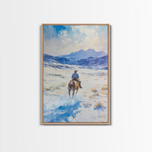Load image into Gallery viewer, Cowboy riding through snowy mountain pass, Framed Canvas Print, western winter landscape wall art, farmhouse holiday decor Christmas gift