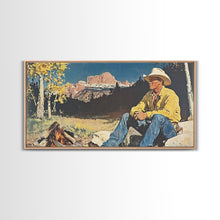 Load image into Gallery viewer, Bold monochromatic Framed Canvas Print showcasing a woman in a cowboy hat with horses in a snowy mountain landscape, rustic winter wall art