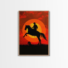 Load image into Gallery viewer, Cowboy on Horse with Dramatic Sunset Background | Framed Canvas Print | Western Silhouette Art | Sunset Cowboy Wall Art for Bedroom