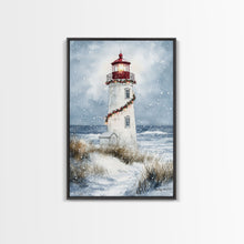 Carregar imagem no visualizador da galeria, Snowy lighthouse wrapped with festive garland, Framed Canvas Print, beach Christmas decor, holiday wall art perfect for coastal homes