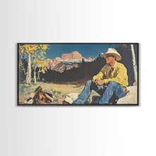 Load image into Gallery viewer, Bold monochromatic Framed Canvas Print showcasing a woman in a cowboy hat with horses in a snowy mountain landscape, rustic winter wall art