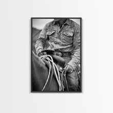 Load image into Gallery viewer, Close-up of cowboy hands holding reins, detailed Western art, black and white photography, Framed Canvas Print, rustic home decor, wall art