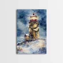 Load image into Gallery viewer, Snowy lighthouse under moonlit sky with wreath, Framed Canvas Print, beach Christmas decor for winter wonderland, holiday wall art