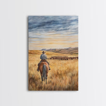 Load image into Gallery viewer, Cowboy leading cattle across golden prairie, Framed Canvas Print, western landscape wall art for rustic farmhouse decor, gift idea holiday