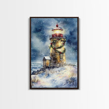 Load image into Gallery viewer, Snowy lighthouse under moonlit sky with wreath, Framed Canvas Print, beach Christmas decor for winter wonderland, holiday wall art