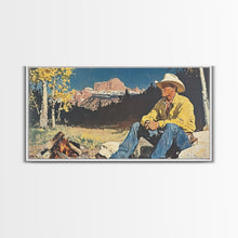 Load image into Gallery viewer, Bold monochromatic Framed Canvas Print showcasing a woman in a cowboy hat with horses in a snowy mountain landscape, rustic winter wall art