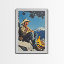 Load image into Gallery viewer, Cowboy Resting by the Fire Canvas Print, Winter Mountain Scene, Seasonal Wall Art, Rustic Western Decor, Holiday Gift, Framed Canvas Print