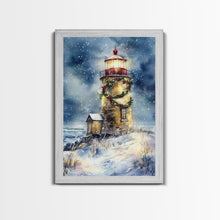 Load image into Gallery viewer, Snowy lighthouse under moonlit sky with wreath, Framed Canvas Print, beach Christmas decor for winter wonderland, holiday wall art
