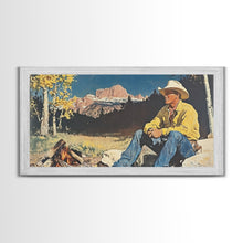 Load image into Gallery viewer, Bold monochromatic Framed Canvas Print showcasing a woman in a cowboy hat with horses in a snowy mountain landscape, rustic winter wall art