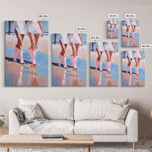 Load image into Gallery viewer, Cowgirls walking on the beach wearing pink cowboy boots, artistic reflection Framed Canvas Print - beach fashion, summer decor, vibrant art