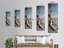 Carregar imagem no visualizador da galeria, Framed Canvas Print Skinny Art of a Weathered Driftwood Tree Trunk on a Sandy Shore with a Calm Ocean Backdrop, Ideal Tall Art for Coastal Decor