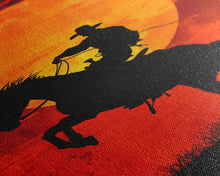 Load image into Gallery viewer, Cowboy Riding Horse into the Sunset | Framed Canvas Print | Western Silhouette Art | Rustic Cowboy Wall Art for Living Room