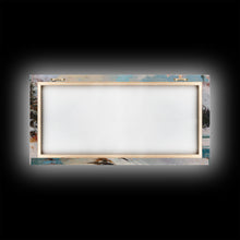 Load image into Gallery viewer, Cowboy on horseback near hay bale outside rustic barn, snow-covered landscape, Framed Canvas Print, winter wall art, rustic farmhouse decor