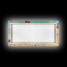 Load image into Gallery viewer, Cowboy in red jacket riding through snow-covered forest, Framed Canvas Print, vibrant winter wall art, rustic western decor