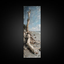 Carregar imagem no visualizador da galeria, Framed Canvas Print Skinny Art of a Weathered Driftwood Tree Trunk on a Sandy Shore with a Calm Ocean Backdrop, Ideal Tall Art for Coastal Decor