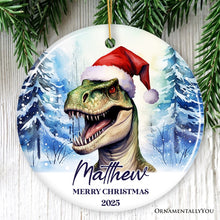 Load image into Gallery viewer, Dinosaur with Santa Hat Personalized Ornament, Winter Forest Christmas Gift With Custom Name and Date