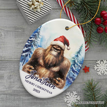 Load image into Gallery viewer, Bigfoot with Santa Hat Personalized Ornament, Winter Forest Christmas Gift With Custom Name and Date