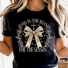 Carregar imagem no visualizador da galeria, Jesus Is the Reason Christmas T‑Shirt, Coquette Gold Bow Cross Tee for Faithful Women