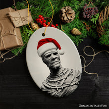 Carregar imagem no visualizador da galeria, Ghoulish Mummy with Santa Hat Ornament, Sinister Holiday Keepsake for Halloween Lovers