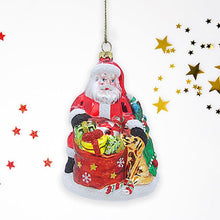 Load image into Gallery viewer, Santa with Dog and Giant Gift Bag Glass Christmas Ornament