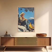 Load image into Gallery viewer, Cowboy Resting by the Fire Canvas Print, Winter Mountain Scene, Seasonal Wall Art, Rustic Western Decor, Holiday Gift, Framed Canvas Print