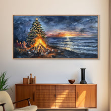 Load image into Gallery viewer, Beach Christmas decor with bonfire, sunset coastal holiday wall art, Christmas tree print, festive coastal art gift, framed canvas print