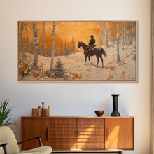Load image into Gallery viewer, Cowboy riding horse through deep snow in a winter storm, Framed Canvas Print, dynamic winter wall art, rustic western home decor