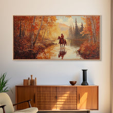 Load image into Gallery viewer, Black white cowboy riding toward snow-covered mountains, Framed Canvas Print, minimalist winter wall art, moody landscape, western decor