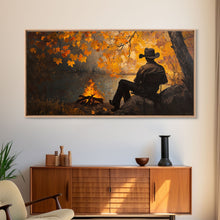 Cargar imagen en el visor de la galería, Cozy autumnal Framed Canvas Print featuring a woman with a mug, surrounded by vibrant fall leaves, perfect seasonal wall art for cozy spaces