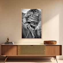 Load image into Gallery viewer, Close-up of cowboy hands holding reins, detailed Western art, black and white photography, Framed Canvas Print, rustic home decor, wall art