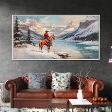 Load image into Gallery viewer, Cowboy on horseback near hay bale outside rustic barn, snow-covered landscape, Framed Canvas Print, winter wall art, rustic farmhouse decor