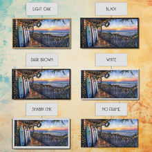 Load image into Gallery viewer, Beachfront porch with surfboards and Christmas lights, Framed Canvas Print with wreaths festive lights, coastal holiday wall art and decor