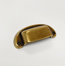 Load image into Gallery viewer, Drawer Cup Pull "Capri" in Antique Brass - Brass Cabinet Hardware