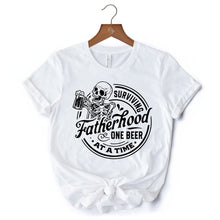 Load image into Gallery viewer, Surviving Fatherhood Skeleton Beer T-Shirt, White Vintage Tee for Tired and Hilarious Dads