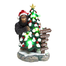Load image into Gallery viewer, Whimsical Bigfoot Behind Christmas Tree Figurine, 7.5" Funny Holiday Yeti LED Statue, He Sees You When You're Sleeping