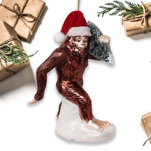 Carregar imagem no visualizador da galeria, Holiday Forest Dweller Bigfoot Glass Christmas Ornament, Yeti and Sasquatch Tree Thief