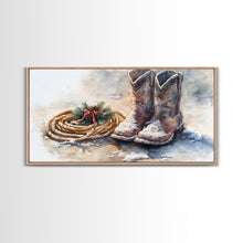 Load image into Gallery viewer, Framed Canvas Print Cowboy Boots and Rope with Pinecones, Rustic Winter Decor, Western Christmas Art, Perfect Holiday Wall Print
