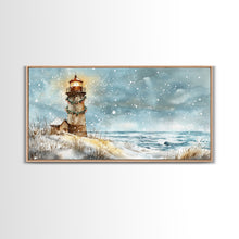 Load image into Gallery viewer, Coastal Christmas Lighthouse Decor Framed Canvas Print, Snowy Beach Scene with Holiday Wreath and Lighthouse Winter Wall Art
