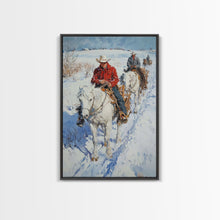 Load image into Gallery viewer, Cowboy Riding Horses in Snow Canvas Print, Winter Wall Art, Rustic Christmas Decor, Holiday Gift Idea, Seasonal Art, Framed Canvas Print
