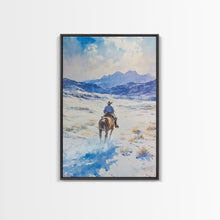 Load image into Gallery viewer, Cowboy riding through snowy mountain pass, Framed Canvas Print, western winter landscape wall art, farmhouse holiday decor Christmas gift
