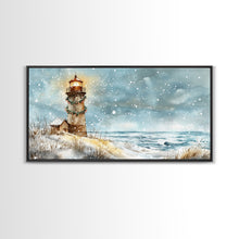 Load image into Gallery viewer, Coastal Christmas Lighthouse Decor Framed Canvas Print, Snowy Beach Scene with Holiday Wreath and Lighthouse Winter Wall Art
