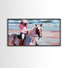 Load image into Gallery viewer, Cowgirl in Pink Shirt Riding Horse by the Sea, Beautiful Framed Canvas Print, Coastal Living Room Art, Beach Bedroom Decor, Horse Art
