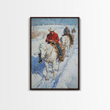 Load image into Gallery viewer, Cowboy Riding Horses in Snow Canvas Print, Winter Wall Art, Rustic Christmas Decor, Holiday Gift Idea, Seasonal Art, Framed Canvas Print
