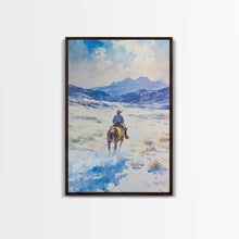 Load image into Gallery viewer, Cowboy riding through snowy mountain pass, Framed Canvas Print, western winter landscape wall art, farmhouse holiday decor Christmas gift
