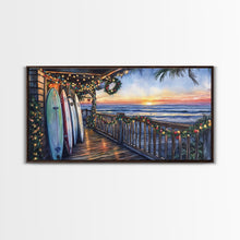 Carregar imagem no visualizador da galeria, Beachfront porch with surfboards and Christmas lights, Framed Canvas Print with wreaths festive lights, coastal holiday wall art and decor
