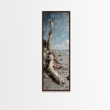 Carregar imagem no visualizador da galeria, Framed Canvas Print Skinny Art of a Weathered Driftwood Tree Trunk on a Sandy Shore with a Calm Ocean Backdrop, Ideal Tall Art for Coastal Decor
