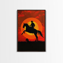 Load image into Gallery viewer, Cowboy on Horse with Dramatic Sunset Background | Framed Canvas Print | Western Silhouette Art | Sunset Cowboy Wall Art for Bedroom
