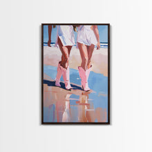 Load image into Gallery viewer, Cowgirls walking on the beach wearing pink cowboy boots, artistic reflection Framed Canvas Print - beach fashion, summer decor, vibrant art
